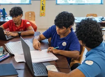 students working on ib extended essay